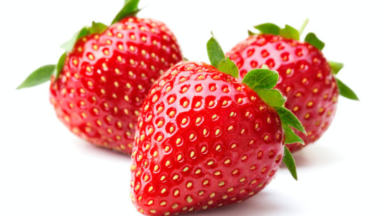 ripe red strawberry fruits isolated on white background